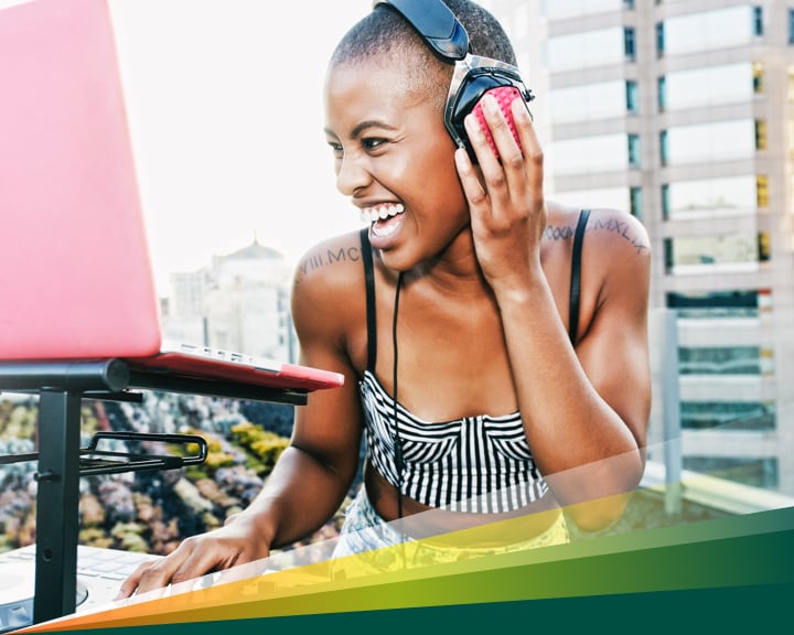 Enthusiastic young woman focusing on DJing
